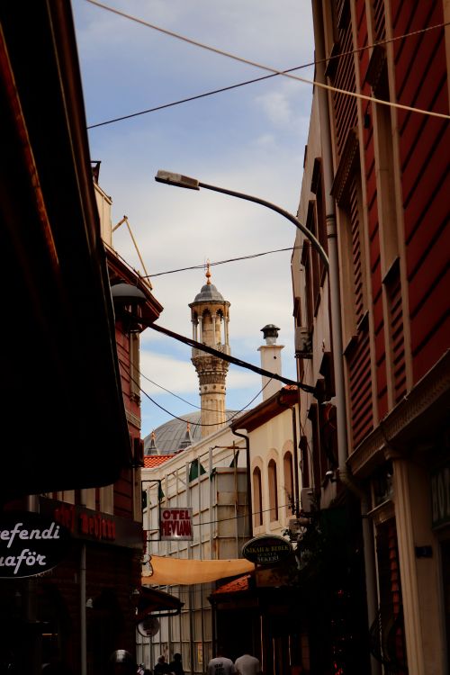 Free Explore the charm of an Istanbul street with a classic minaret in view. Stock Photo