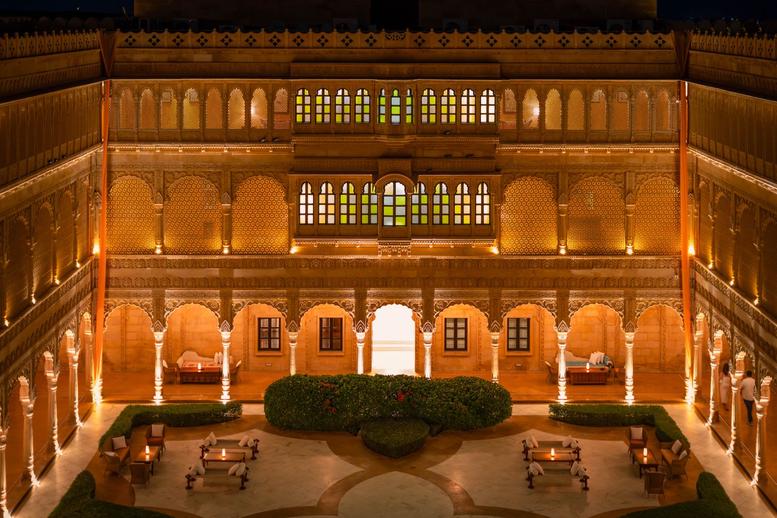 Stunning night view of a beautifully lit palace courtyard in Jaisalmer, Rajasthan, India, showcasing exquisite architecture.