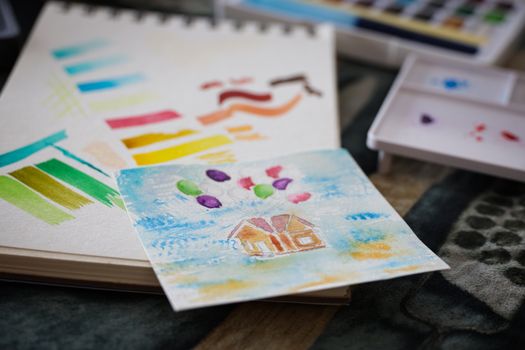 Bright watercolor art with paint and brushes. Ideal for art and education themes.