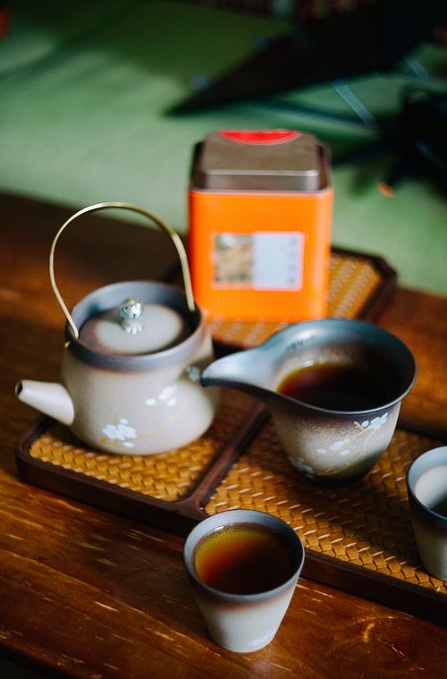 Free A beautifully arranged traditional Japanese tea set on a wooden table, perfect for tranquil moments. Stock Photo