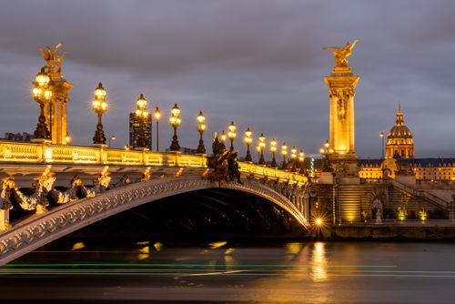 Free Majestic view of the illuminated Pont Alexandre III bridge in Paris at night, a true architectural masterpiece. Stock Photo