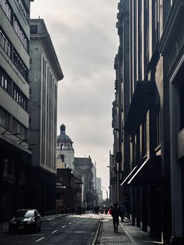 Urban street scene in Callao, Lima, featuring iconic architecture and vibrant city life.