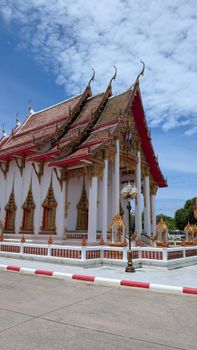 Beautiful Buddhist temple with ornate architecture in Chalong, Phuket.