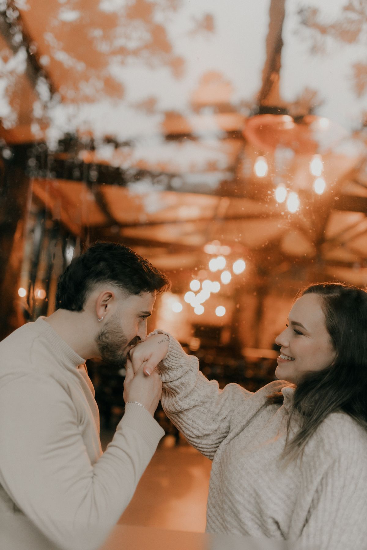 A warm, softly lit cozy embrace by a window