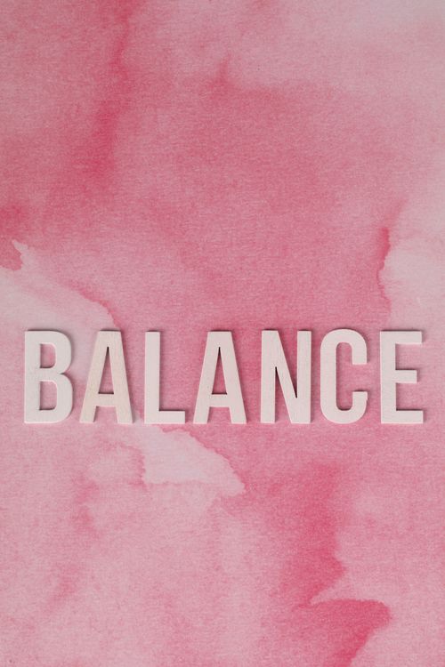 Free Minimalist artwork featuring the word Balance on a pink watercolor background. Stock Photo