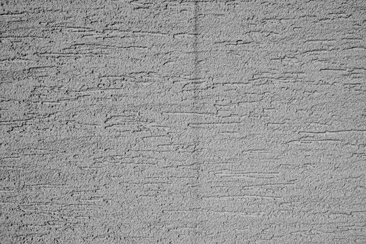 Detailed black and white texture of a concrete wall in Buenos Aires, perfect for backgrounds and artistic projects.