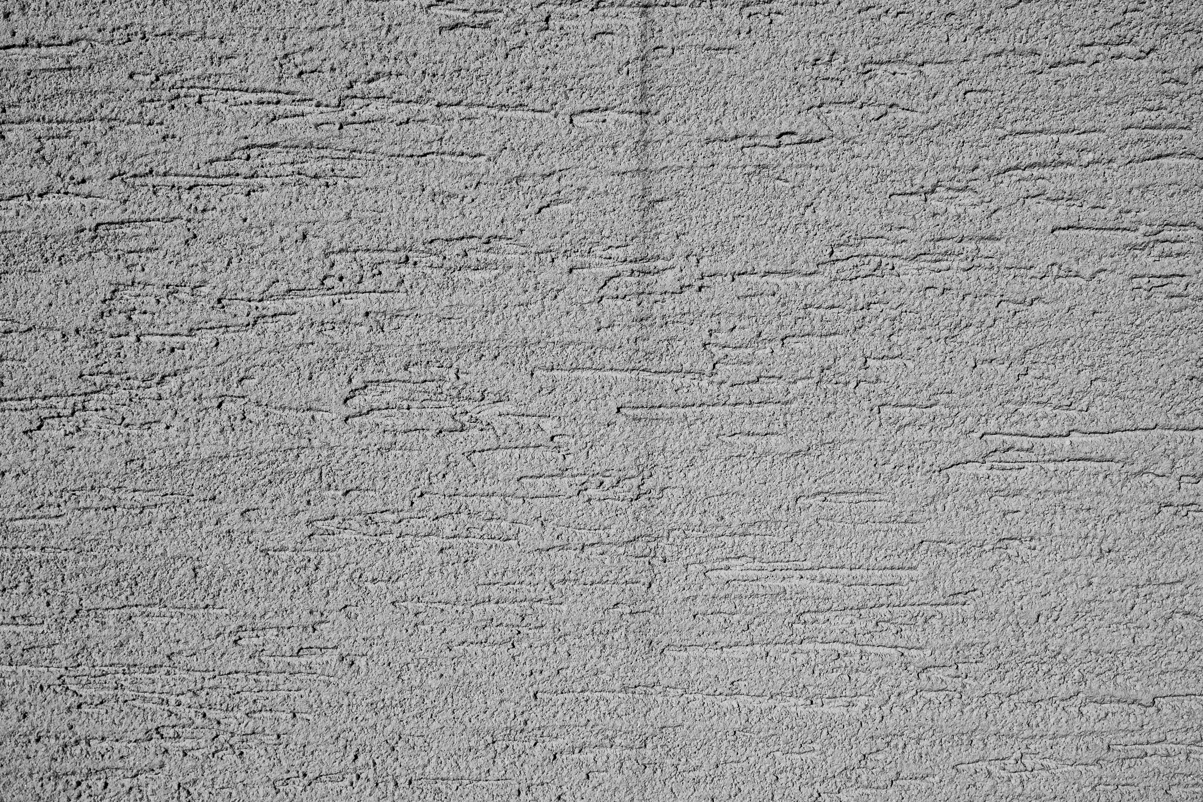 bezplatná Detailní černobílá textura betonové zdi v Buenos Aires, ideální pro pozadí a umělecké projekty. Základová fotografie