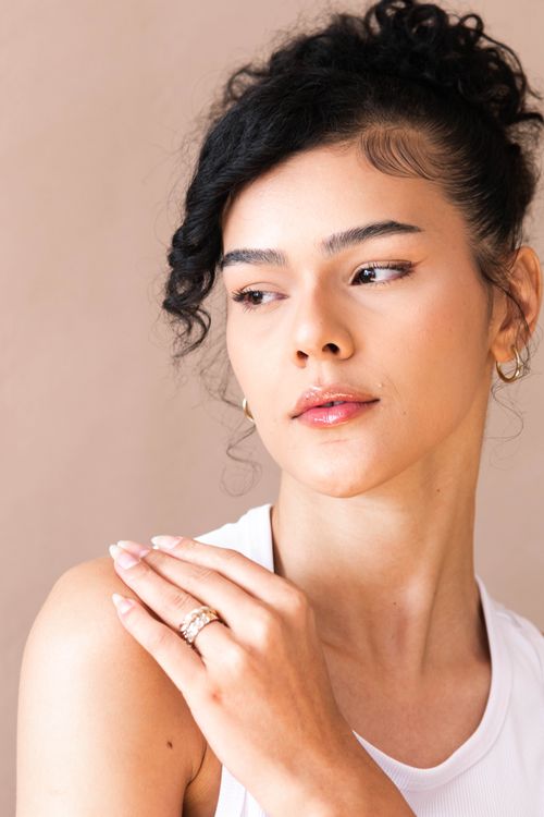 Elegant Portrait of a Woman with Curly Hair · Free Stock Photo