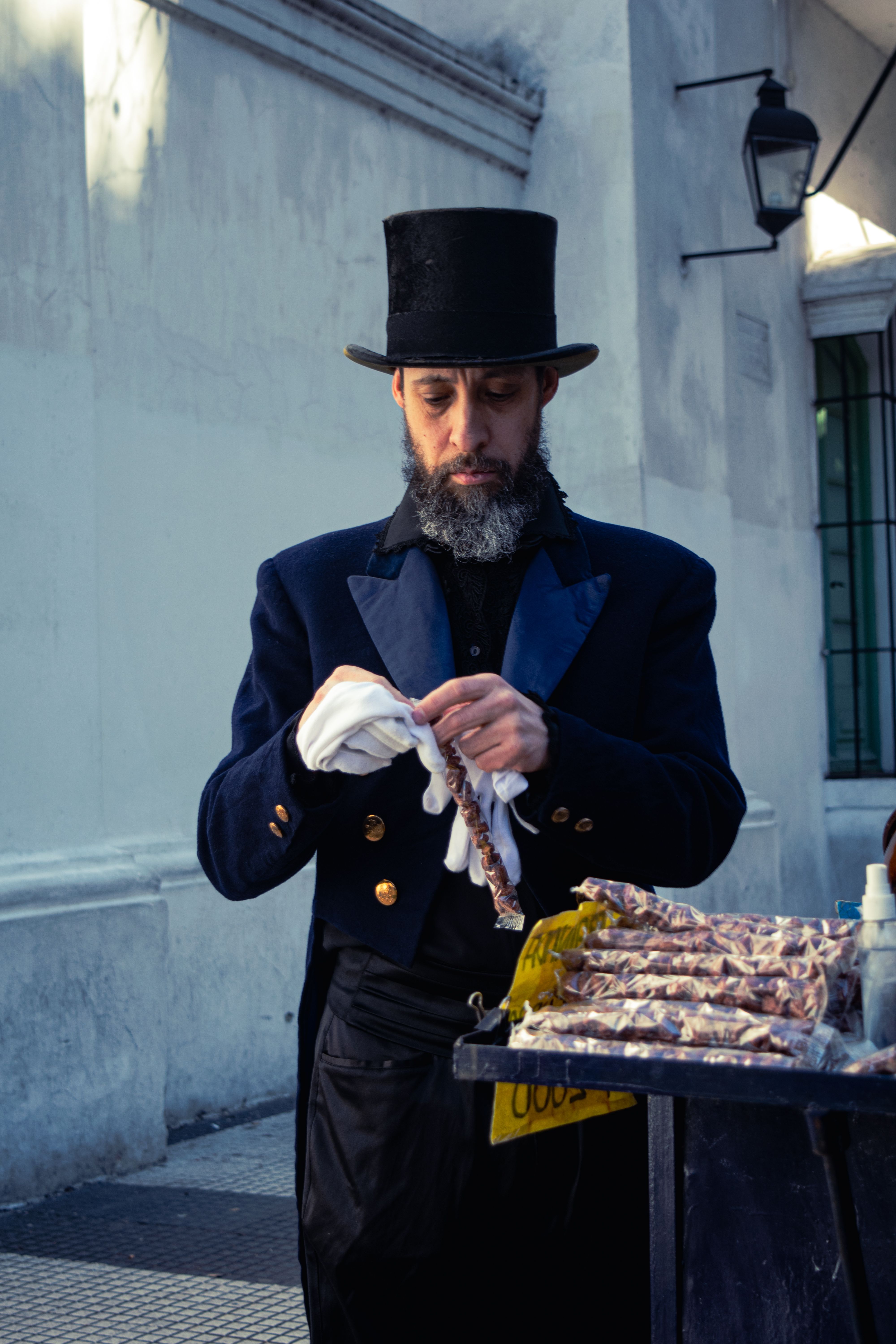 Historical street vendor dressed in vintage attire, Buenos Aires, Argentina.