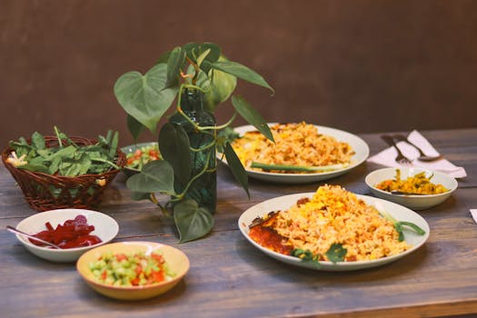 A cozy dining table featuring traditional rice dishes with sides, ideal for a family meal.
