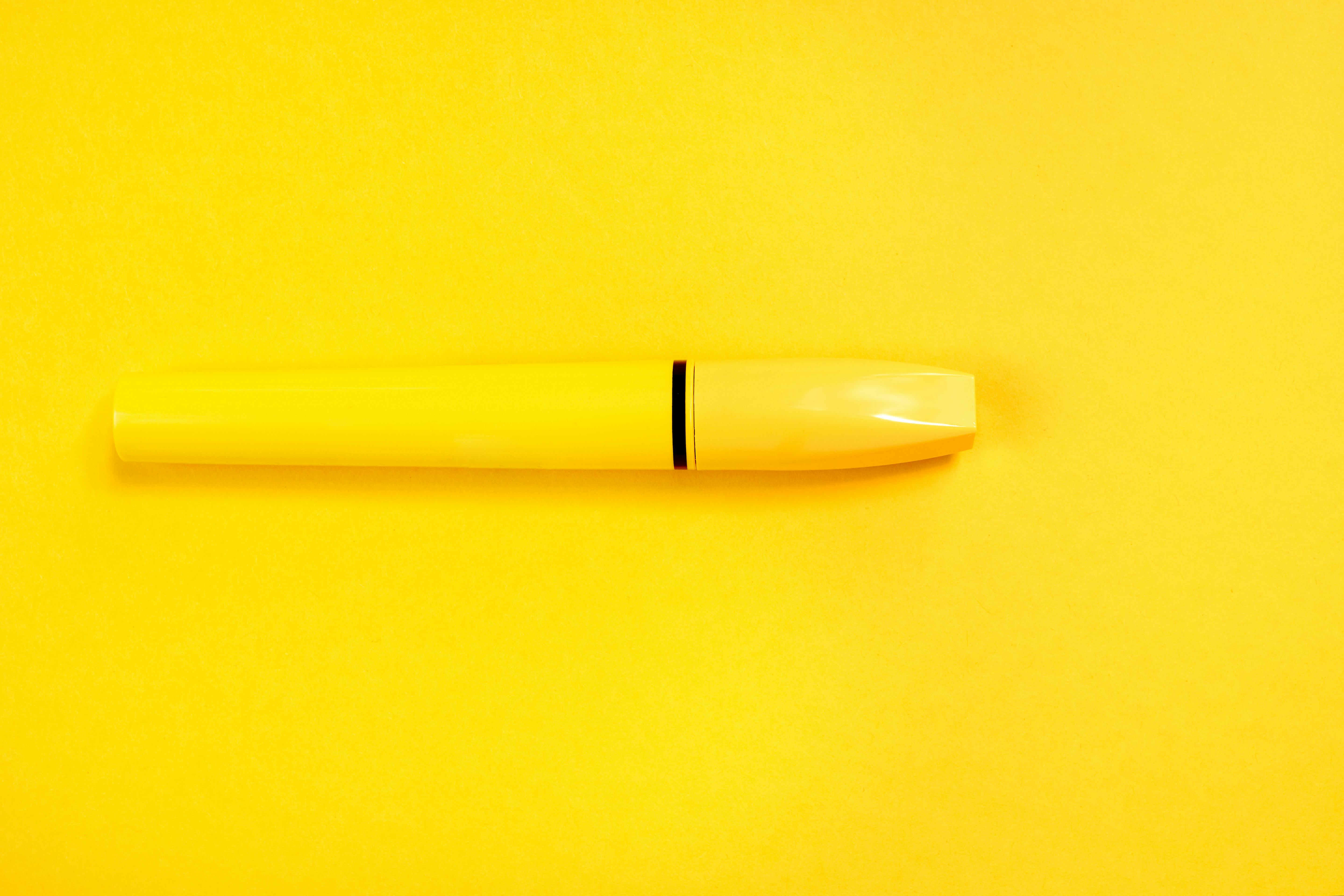 close up photo of yellow container