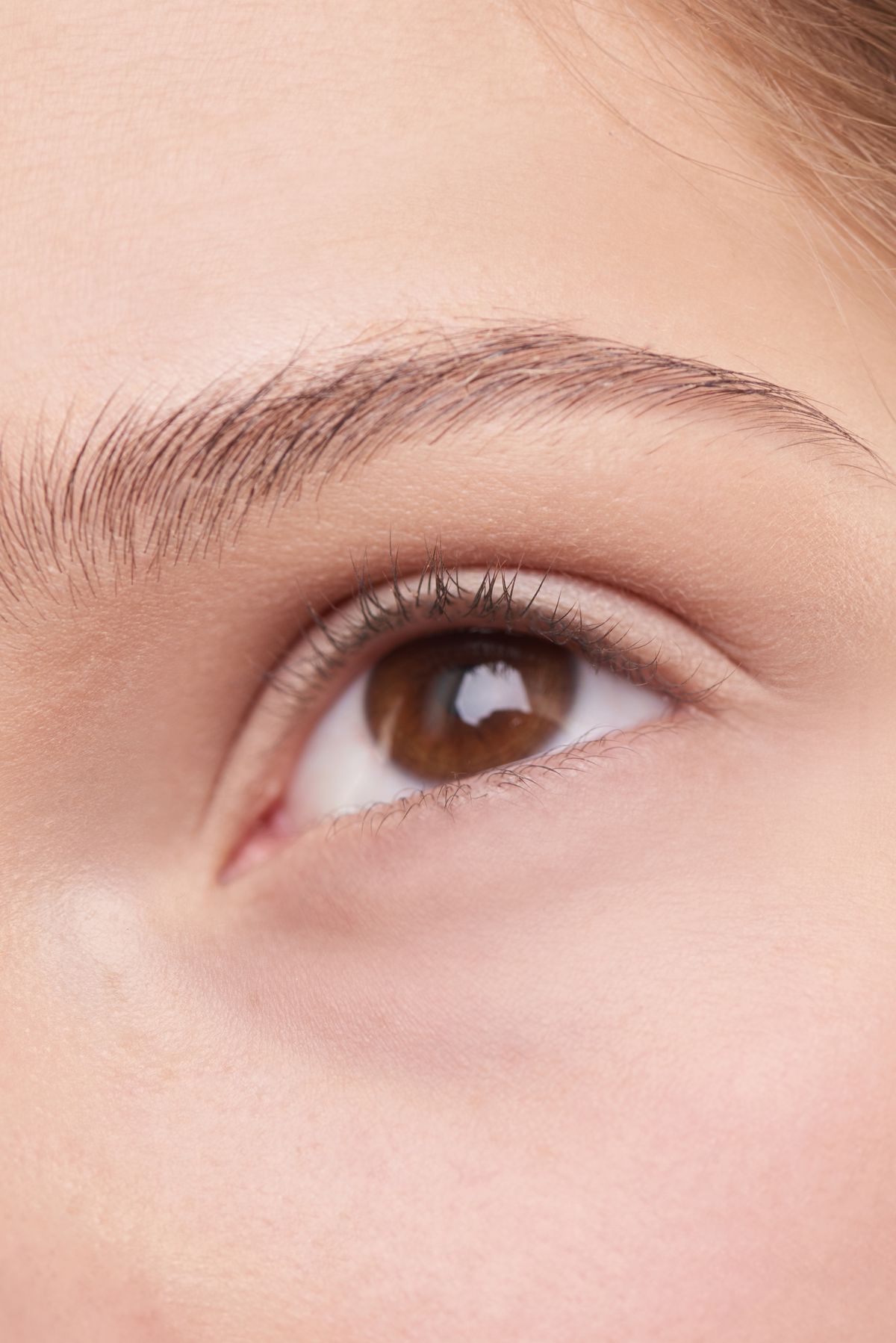 Close-up of a smooth, well-rested eye area and brow