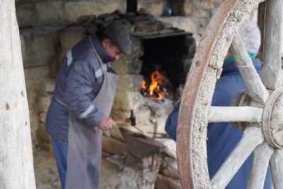 Wheel rim beside the hearth — photo by Tahir Xəlfəquliyev on Pexels