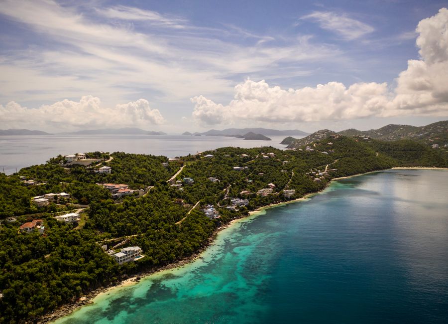 Aerial view of Northside, St Thomas with lush greenery and clear waters.