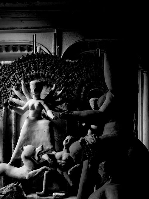 Free Monochrome image of a detailed clay sculpture of a multi-armed deity. Stock Photo
