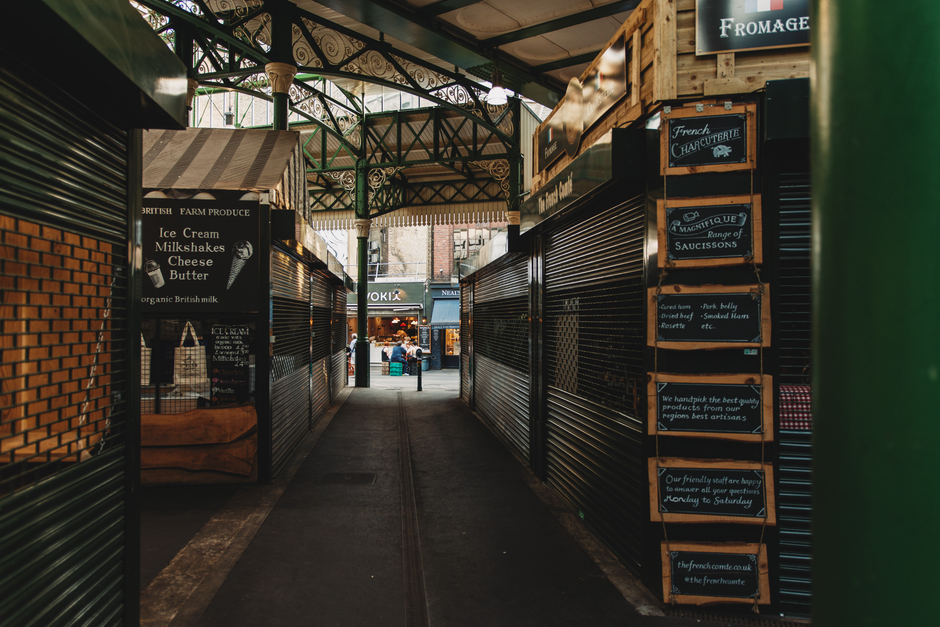 Vibrant Borough Market in London with various food stalls and people