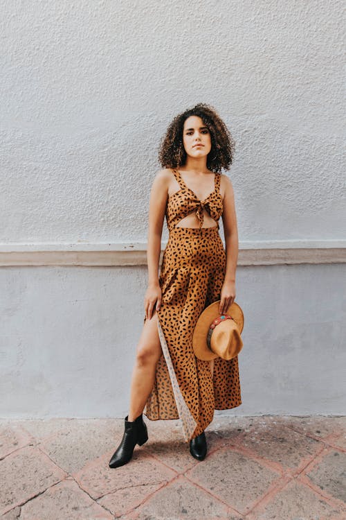 Photo Of Woman Standing Near White Wall