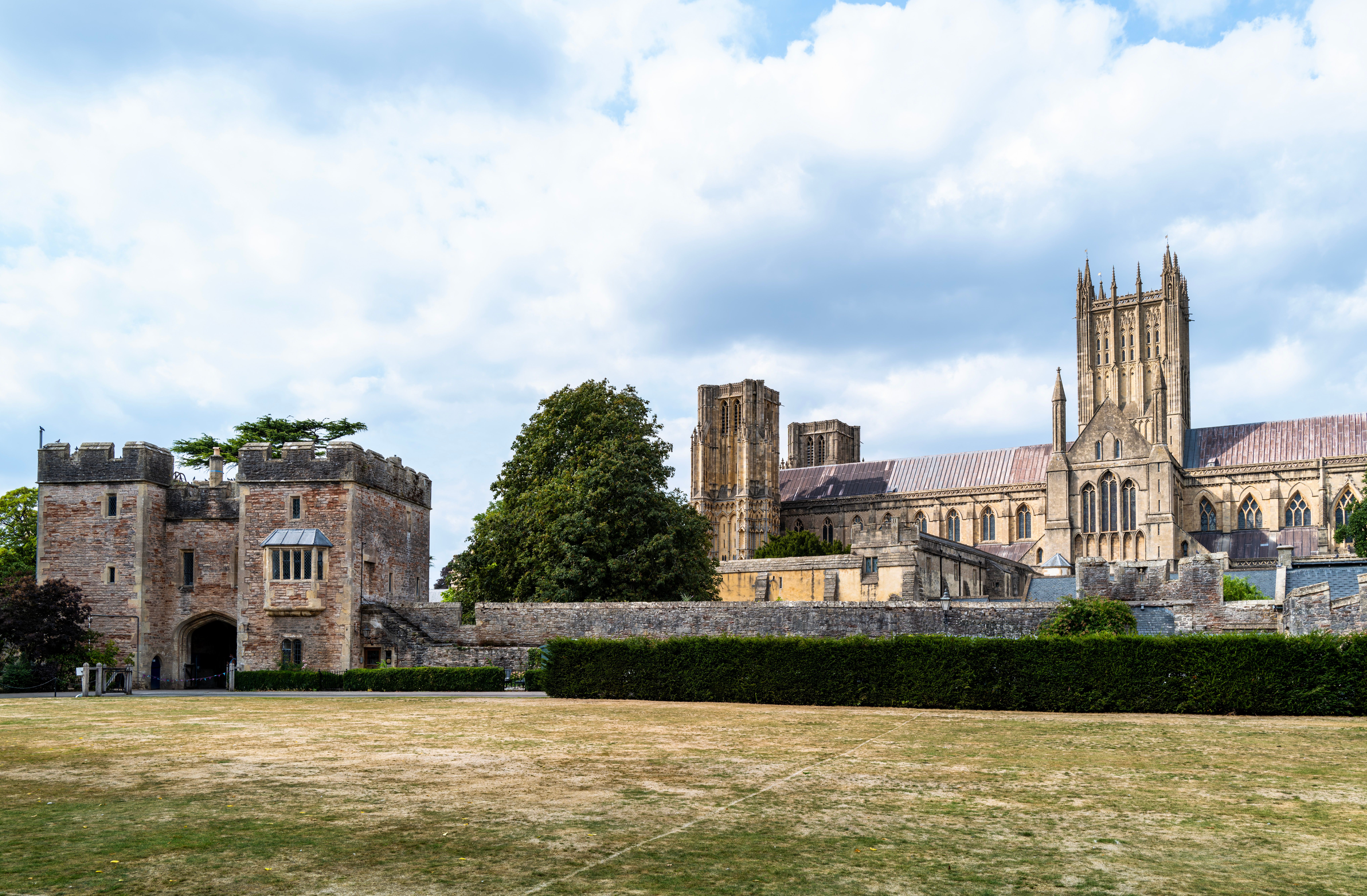 Beautiful view of Wells Cathedral and Bishop's Palace in Somerset, England, showcasing Gothic architecture.