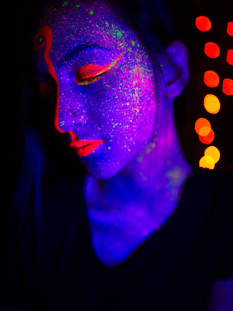 Woman With Pink And Green Glitters On Face