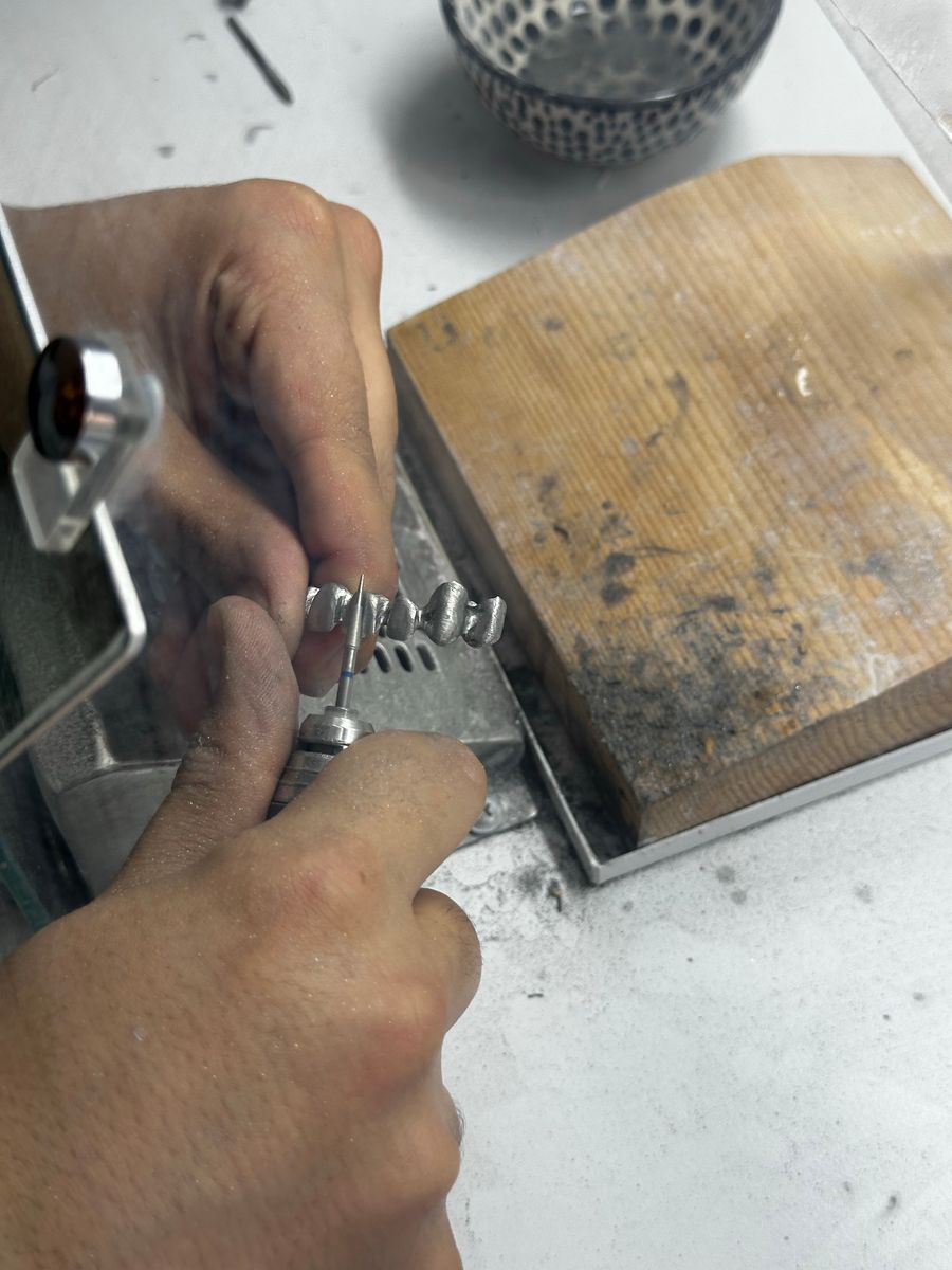Jeweler crafting a silver ring