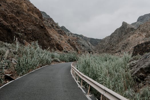 Explore the rugged beauty of Agulo, Canary Islands, with this moody, winding mountain road.