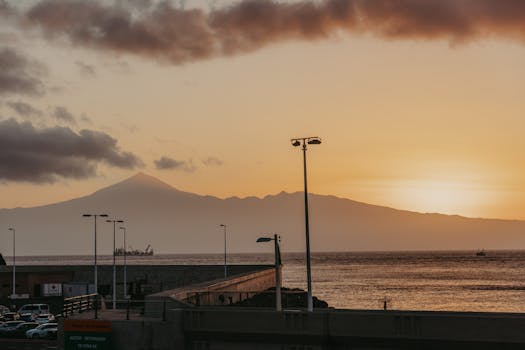 Beautiful sunset over Tenerife viewed from San Sebastián de La Gomera, capturing serene coastal and mountain landscapes.