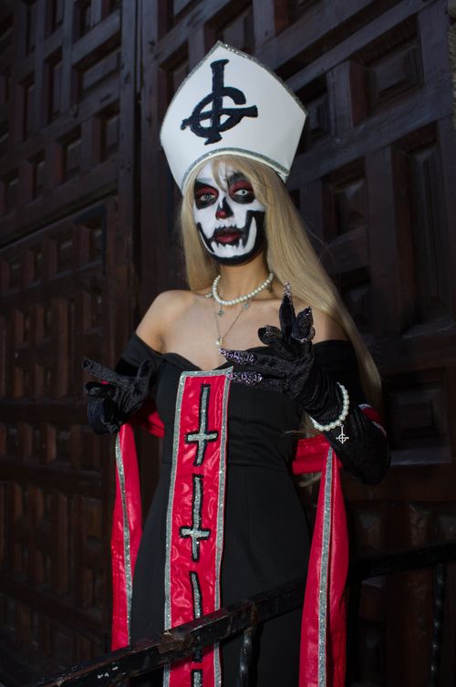 Free Dramatic portrait of a person in Halloween-inspired theatrical makeup and costume. Stock Photo
