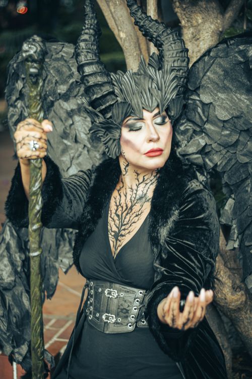 Free A person in a dark fantasy costume with horns and wings, embodying a mythical character outdoors. Stock Photo
