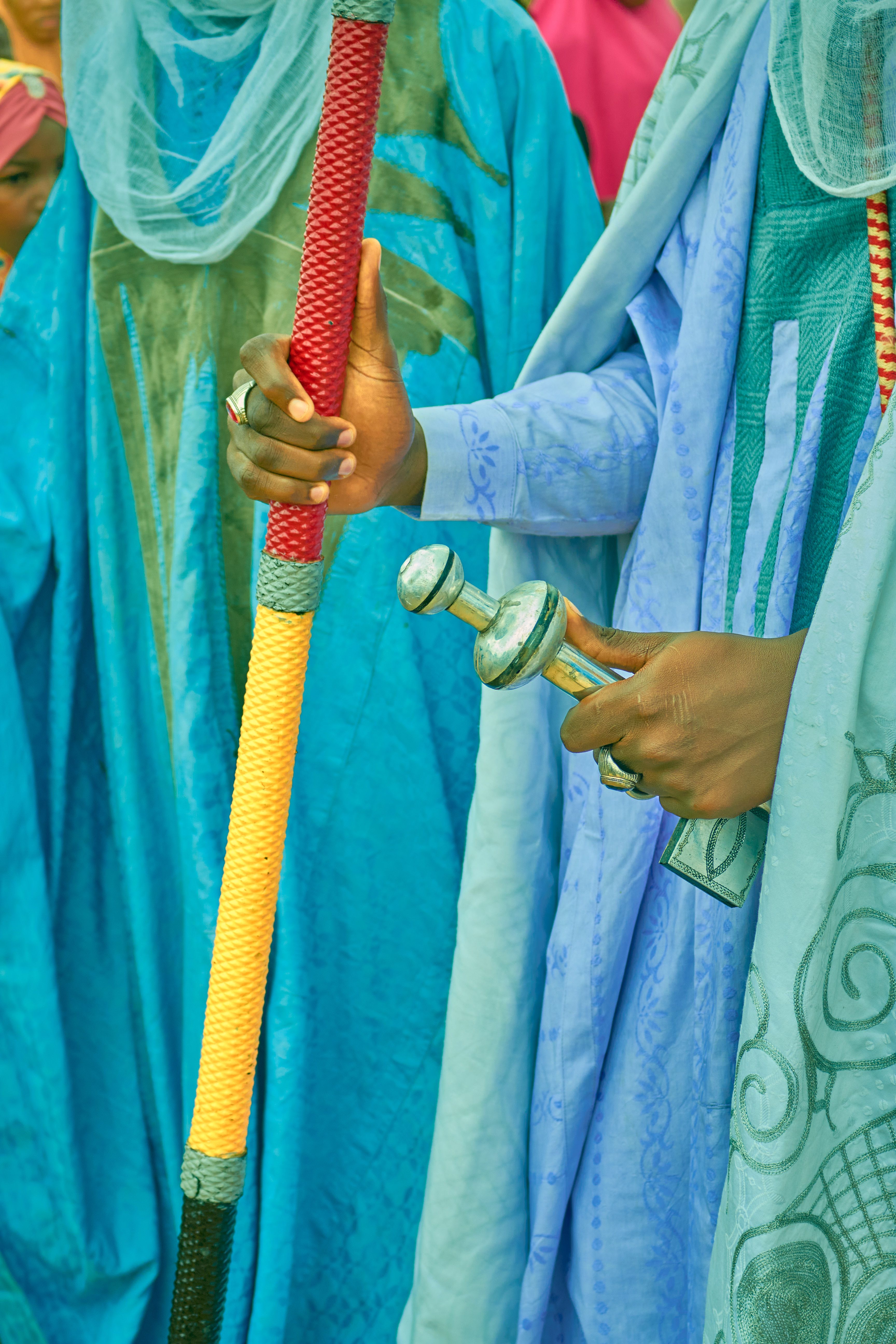 Colorful Traditional Robes and Weapons · Free Stock Photo