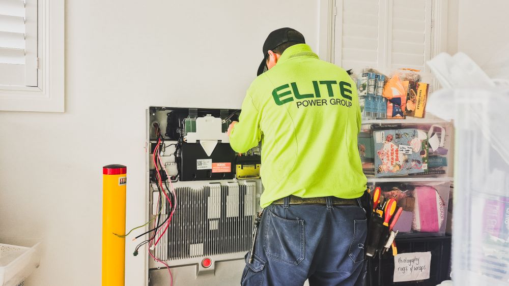 Technician installing a home battery system
