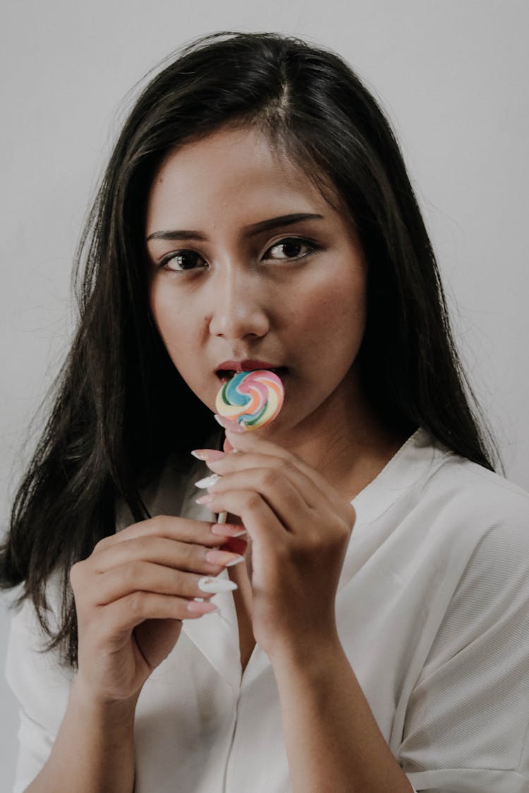 Woman Holding Lollipop