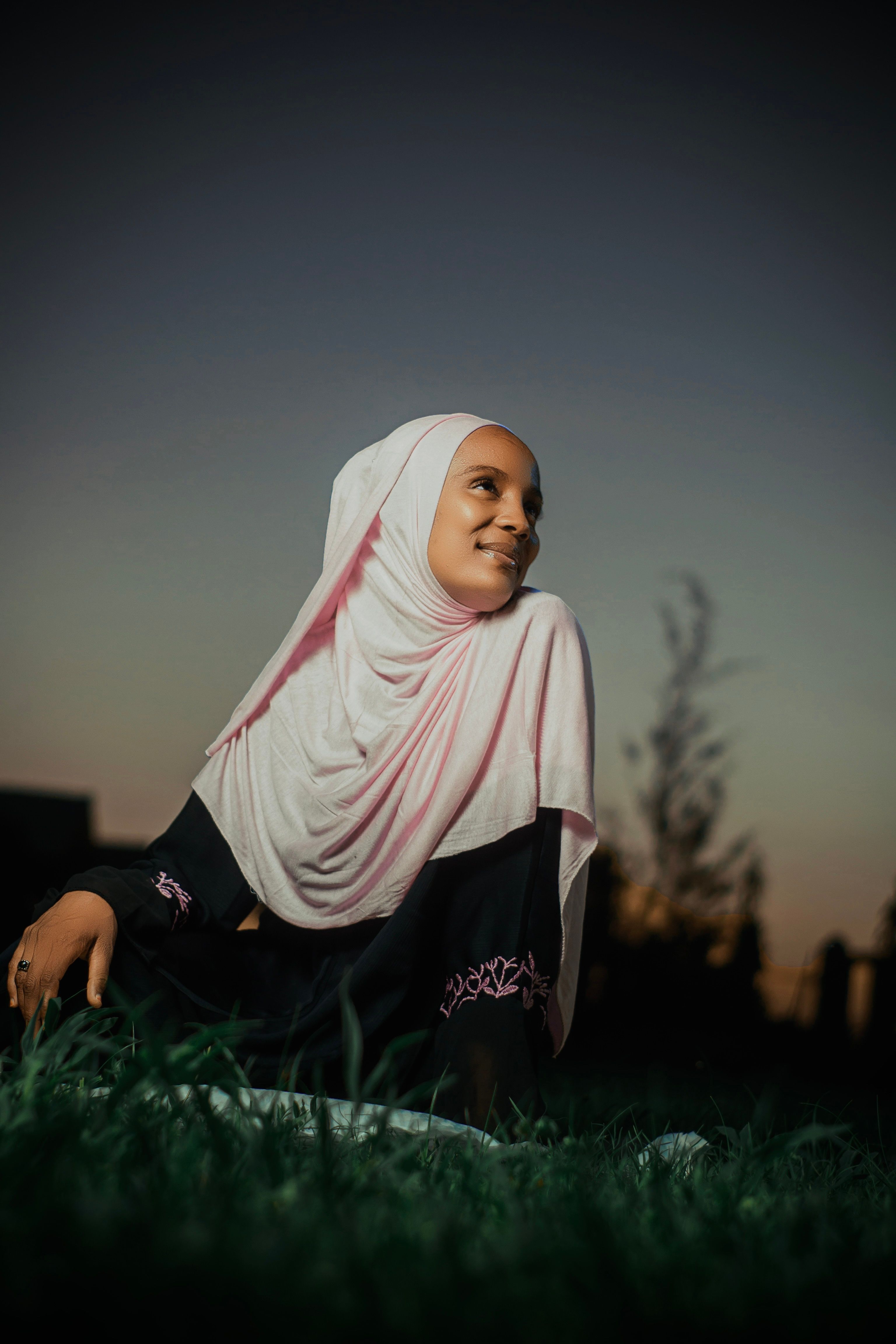 Young Woman in Hijab Enjoying Sunset Outdoors · Free Stock Photo