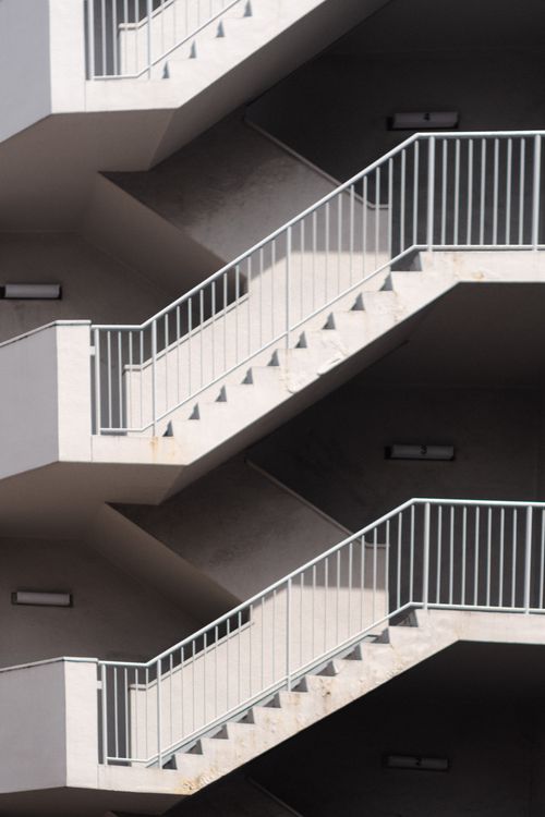 Free Abstract view of a modern outdoor staircase with geometric patterns and shadows. Stock Photo