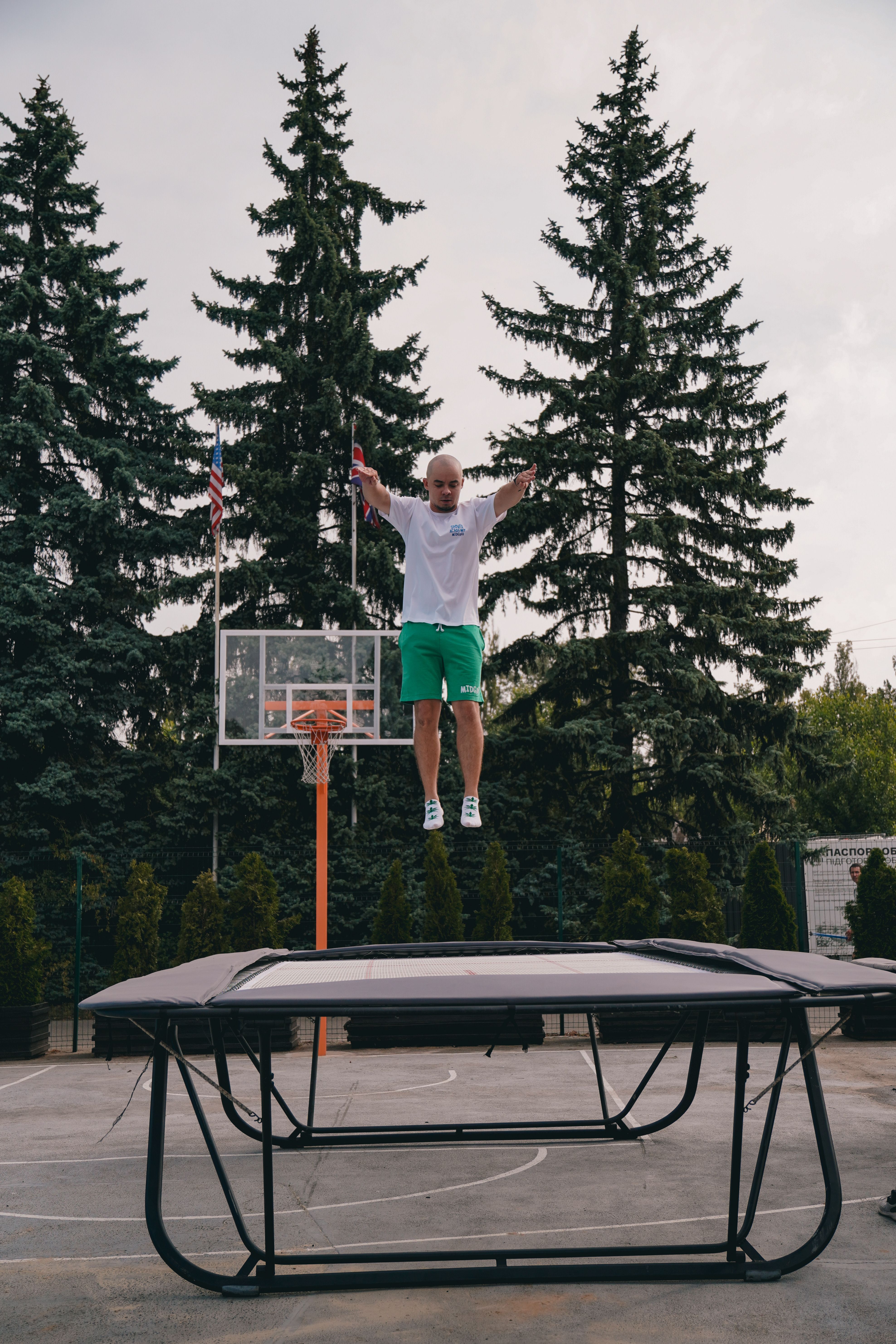 Man Jumping on Trampoline in Outdoor Sports Area · Free Stock Photo