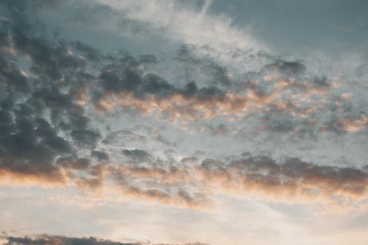 A peaceful sunset with clouds and soft hues, captured over Hungary. Ideal for wallpapers.