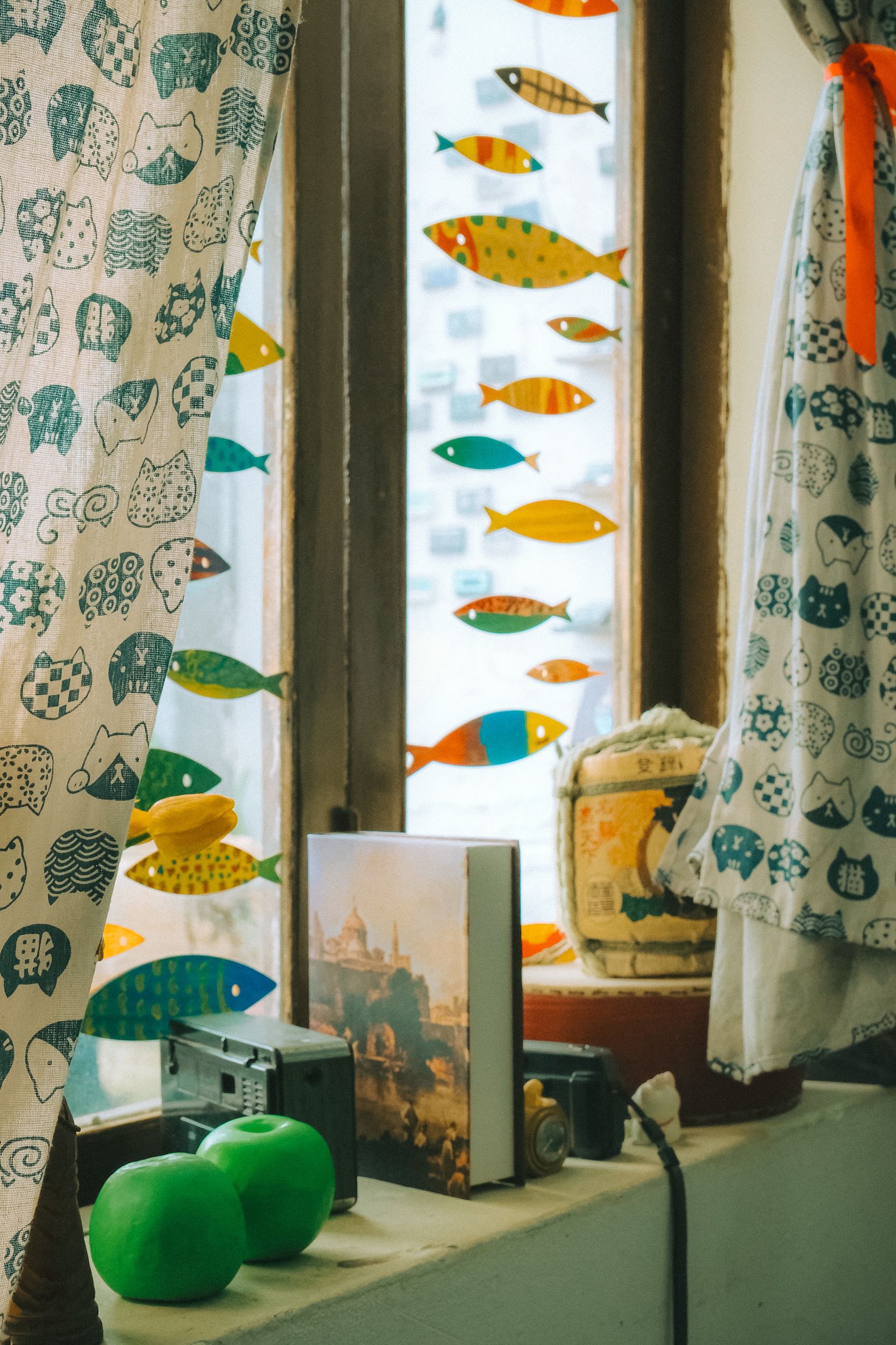 Colorful Fish Decor on Window Sill with Retro Charm · Free Stock Photo
