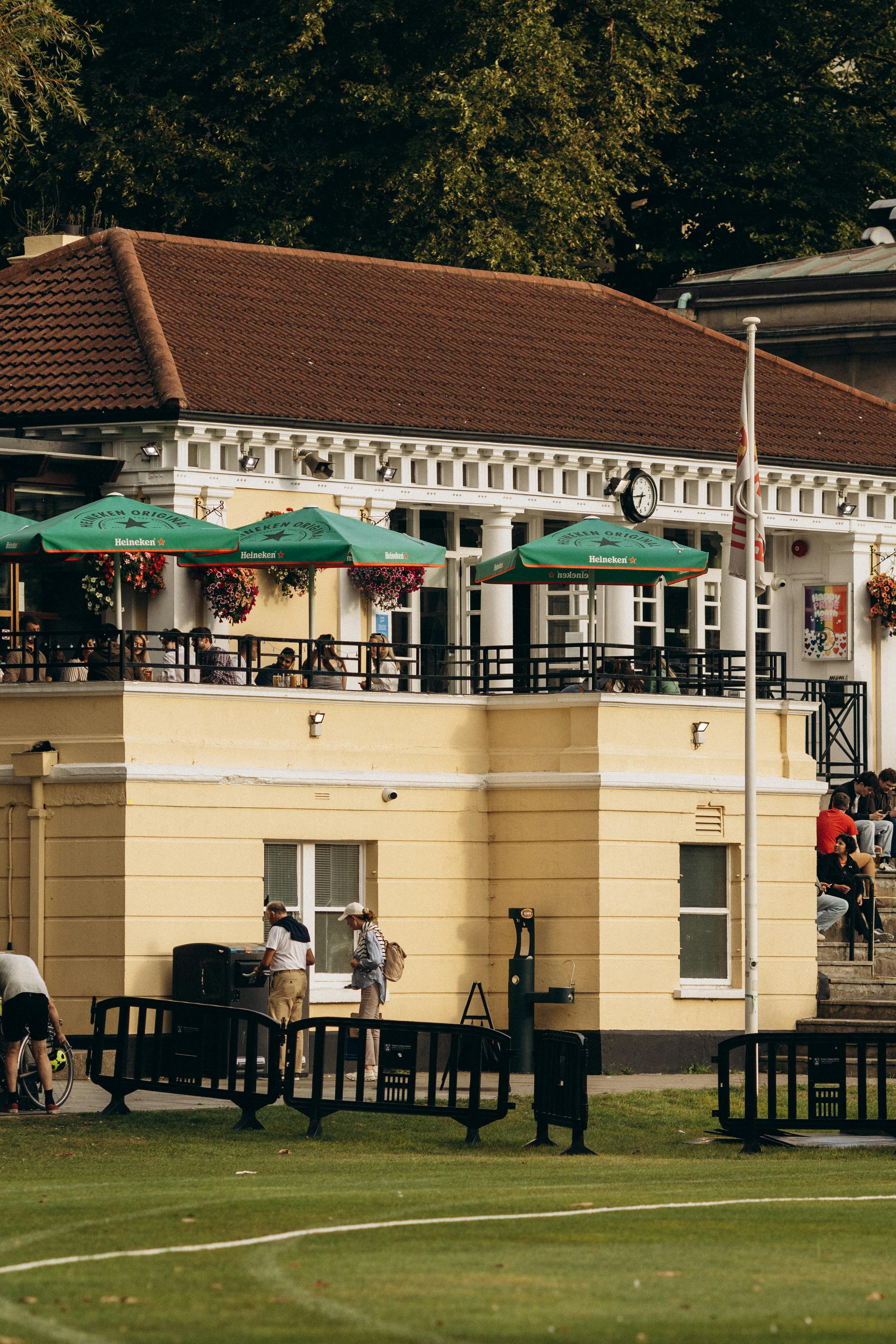 Picturesque outdoor cafe by a sports field in Dublin, Ireland, showcasing a relaxed atmosphere.