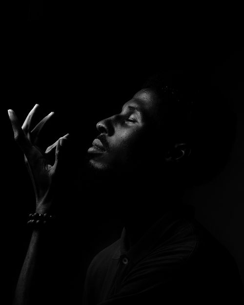 Free Artistic black and white portrait of a man with expressive lighting. Stock Photo