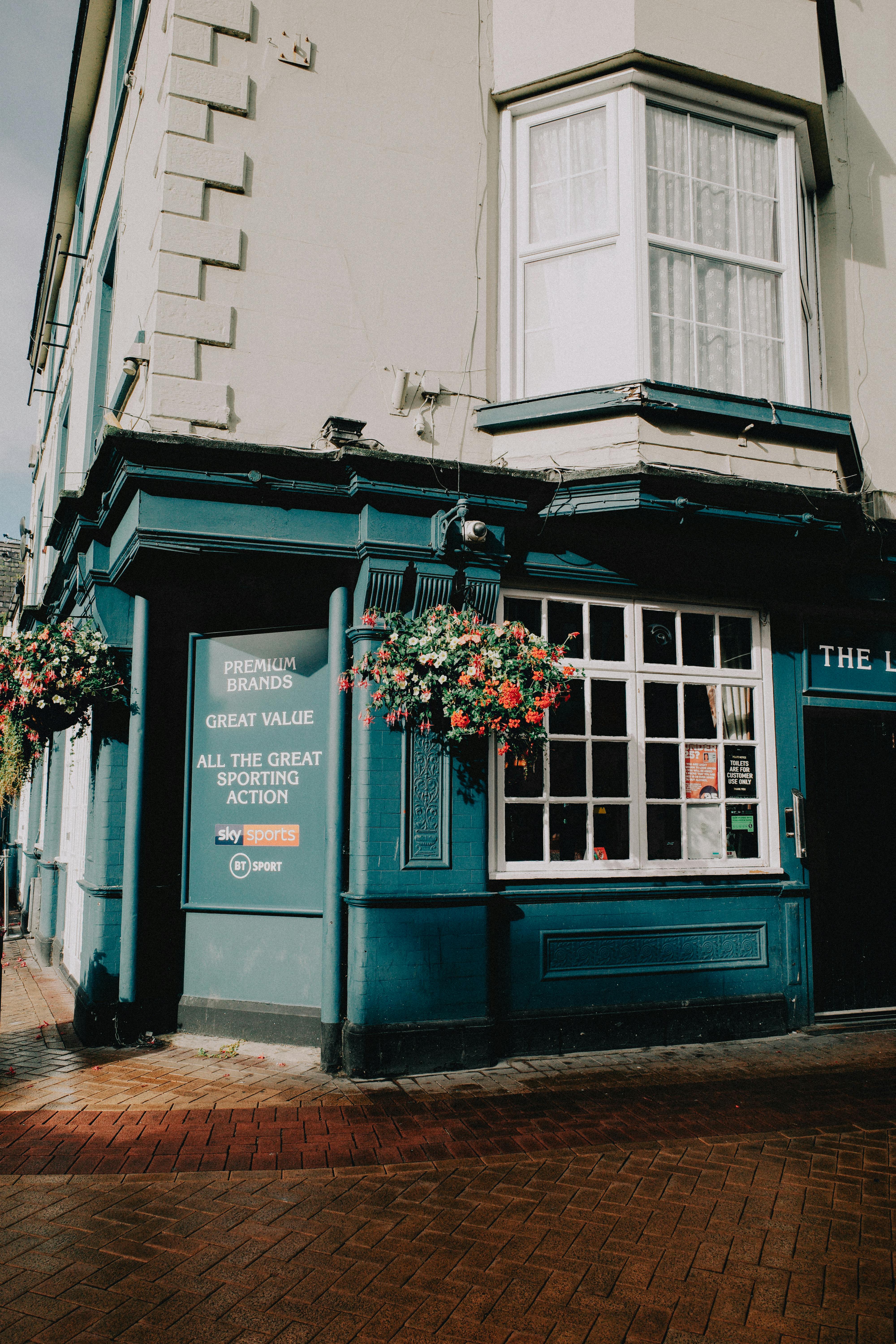 Free Charming corner of a colorful building in Rhyl, Wales, showcasing vibrant architecture and inviting atmosphere. Stock Photo