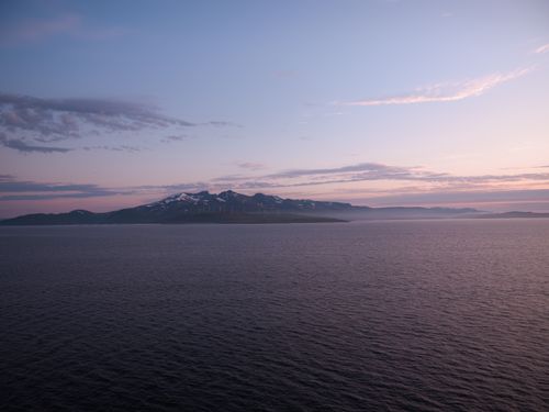 Free Breathtaking view of a Norwegian fjord with mountains at sunset. Stock Photo