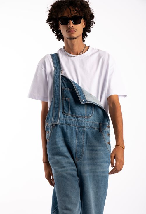 Free Trendy young man in denim overalls and sunglasses, Casablanca style. Stock Photo