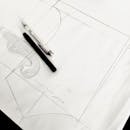 Fashion Design Sketch with Tools on Table