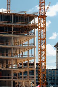 View of a mid-construction high-rise with cranes in Bratislava, Slovensko.