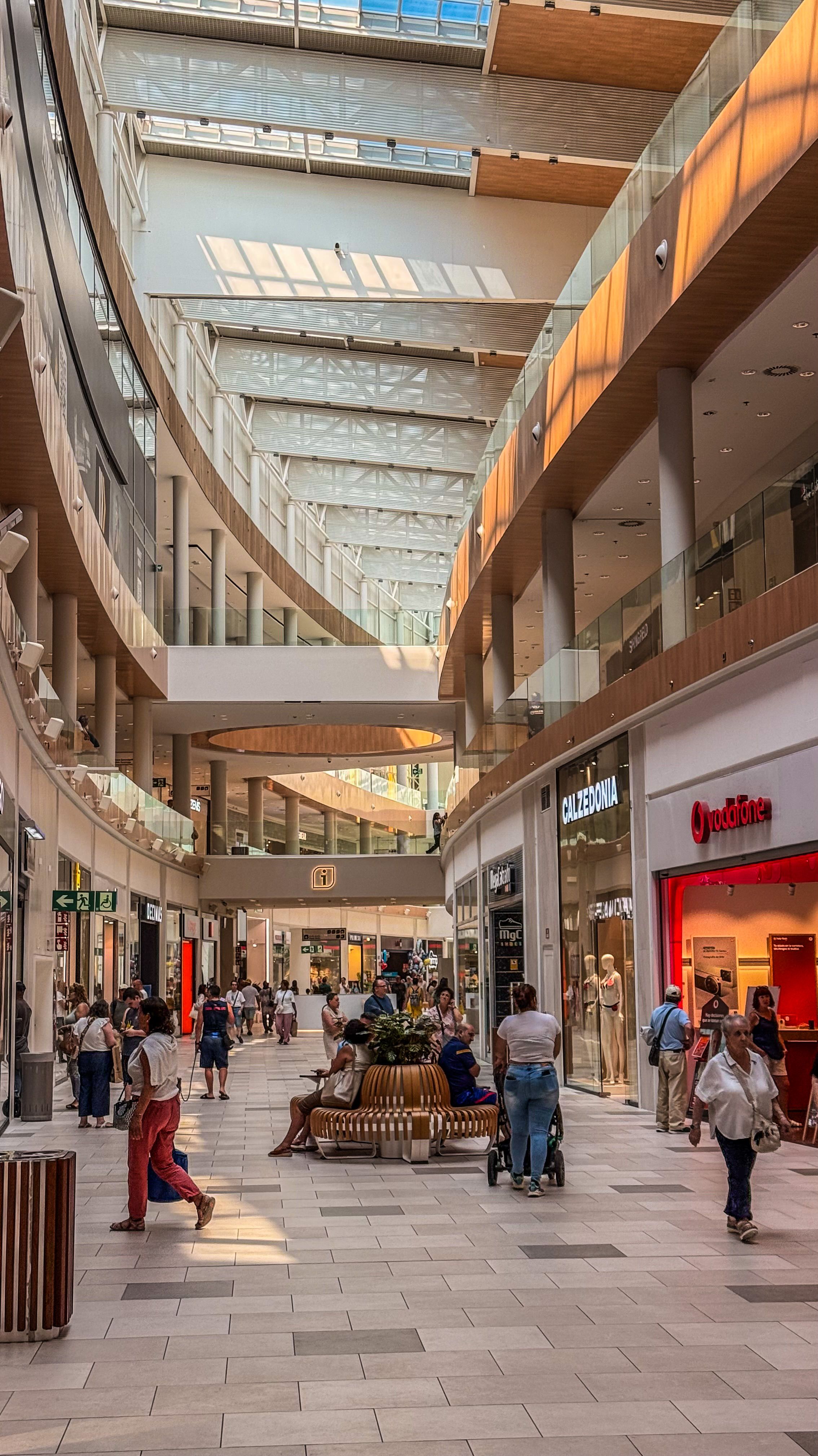 Modern shopping mall with retail stores and pedestrian areas