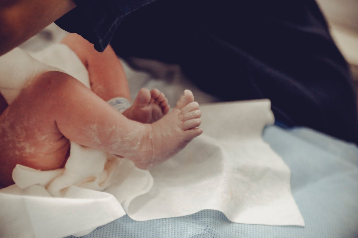 Doctors in discussion in a hospital, echoing The Pitt ensemble dynamic