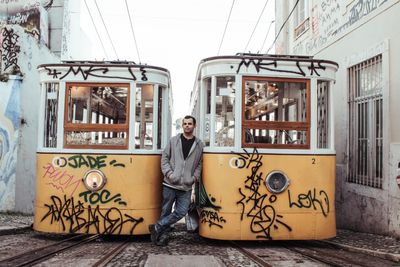 Tram on a narrow Lisbon street — photo by Junior Diniz on Pexels