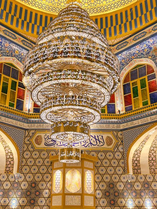 Free Beautiful chandelier in a Kashmiri mosque with intricate Islamic architecture. Stock Photo