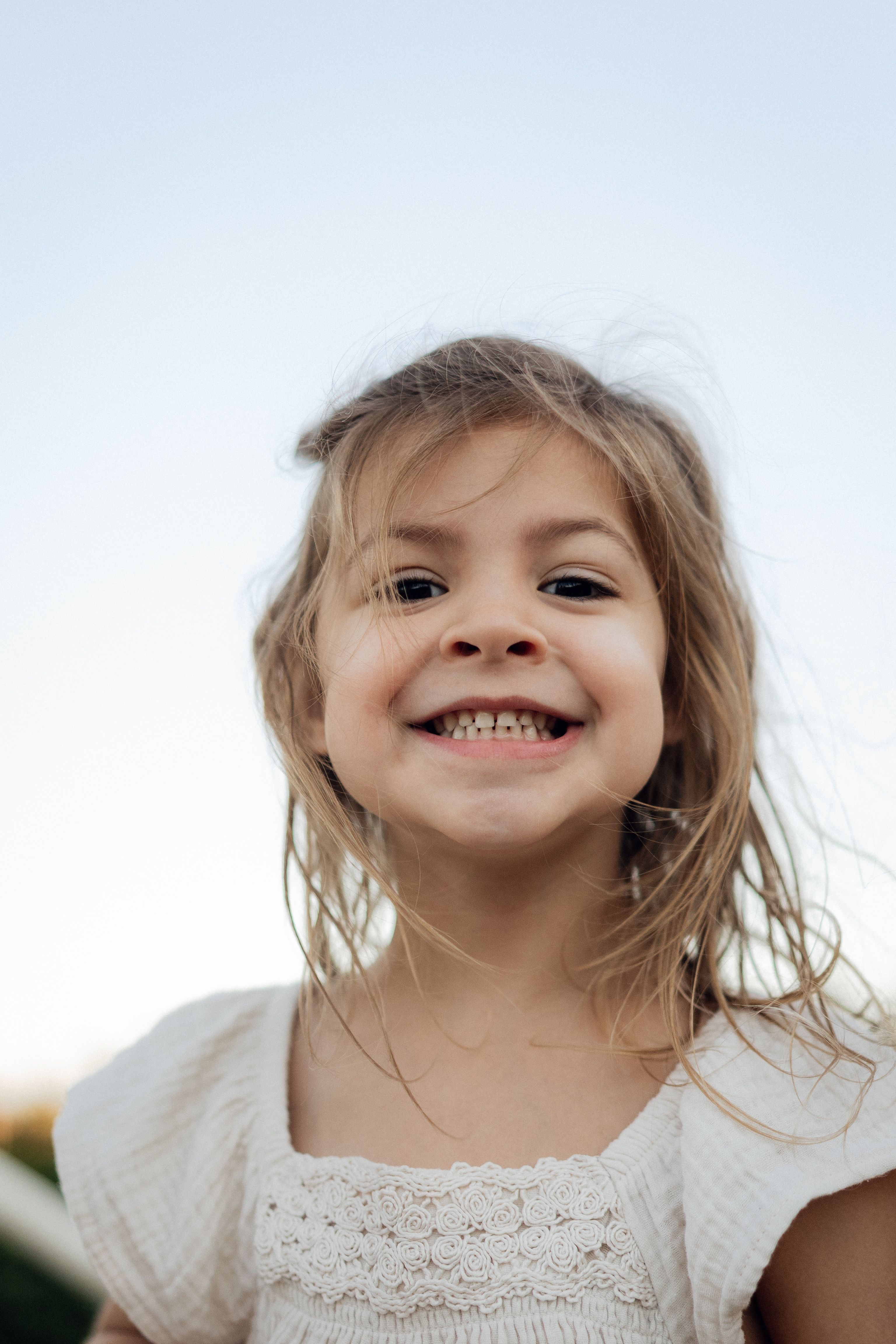 Happy young girl smiling outdoors · Free Stock Photo