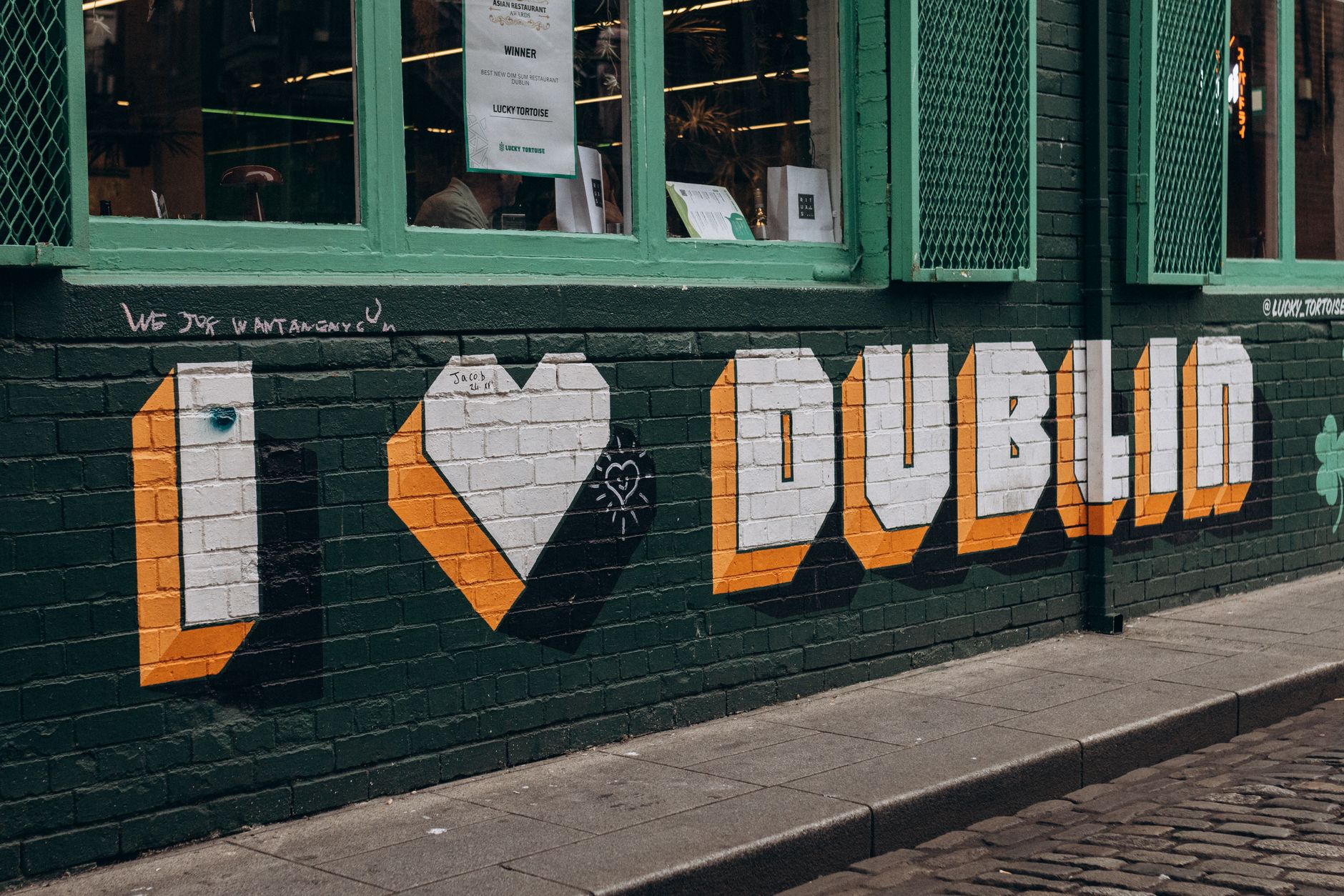 Colorful street art on a Dublin wall showcasing vibrant urban culture.