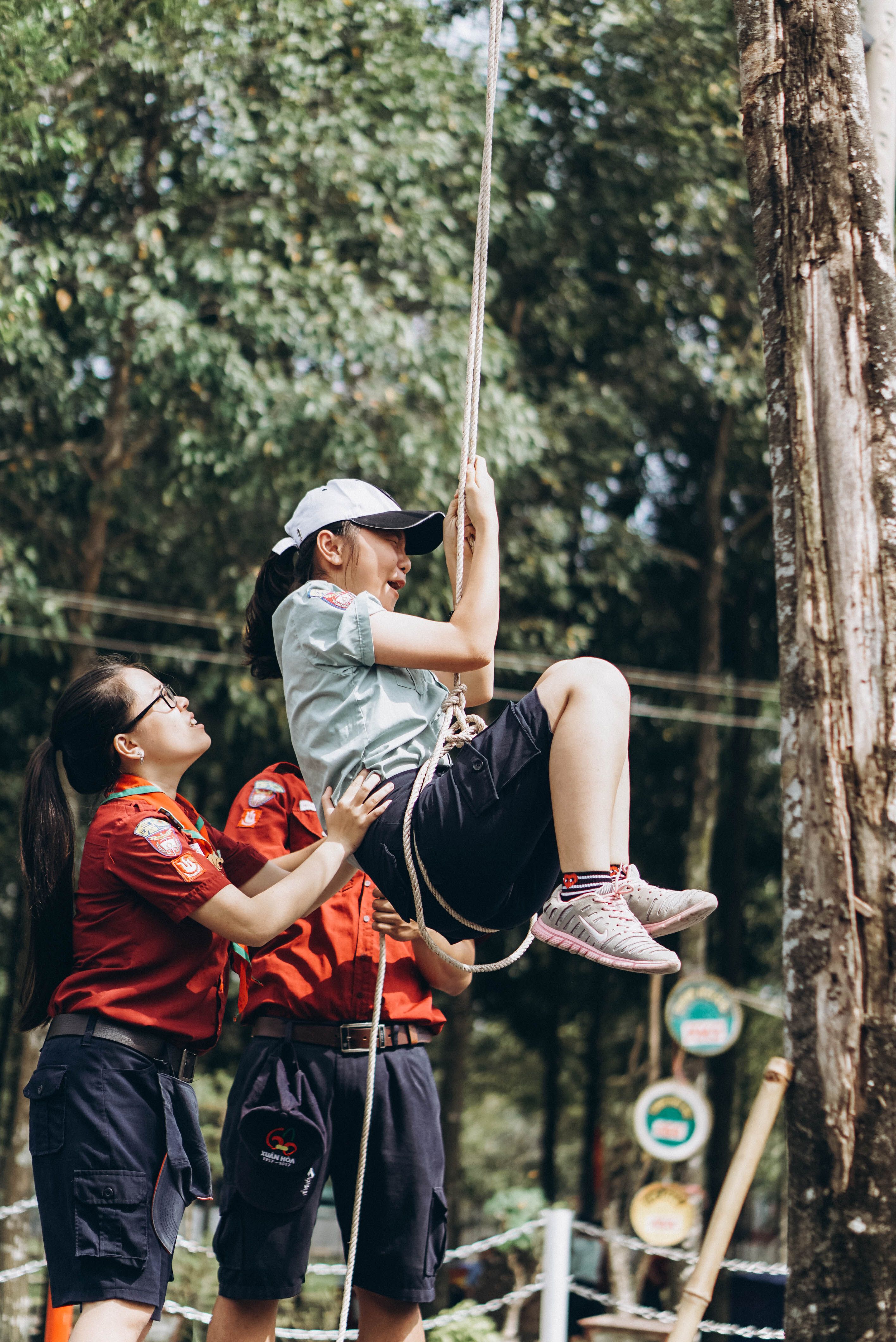 Teens in Outdoor Adventure Rope Climbing · Free Stock Photo